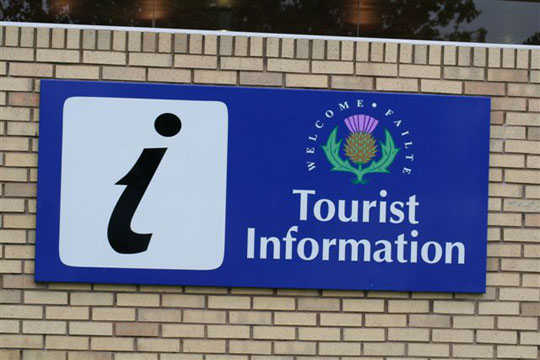 photograph of a tourist information symbol with text